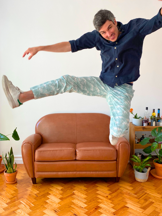Man jumping with pyjama pants